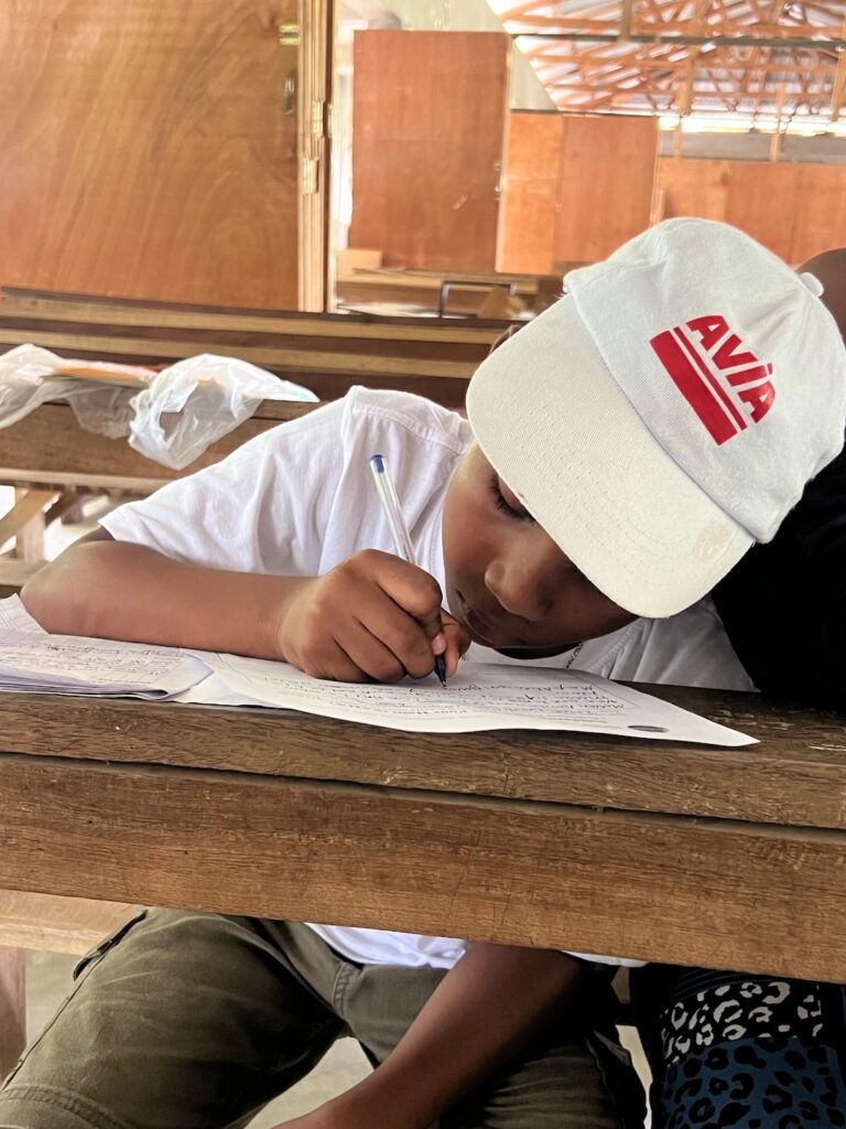 A womenful voice scholarship recipient in class in Haiti A womenful voice scholarship recipient in class in Haiti